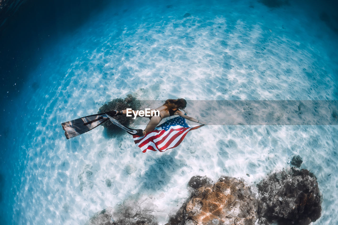 high angle view of people kayaking in sea