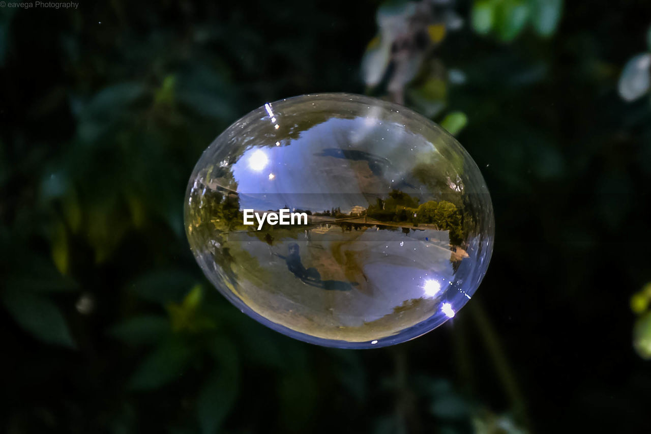 CLOSE-UP OF BUBBLES ON CRYSTAL BALL