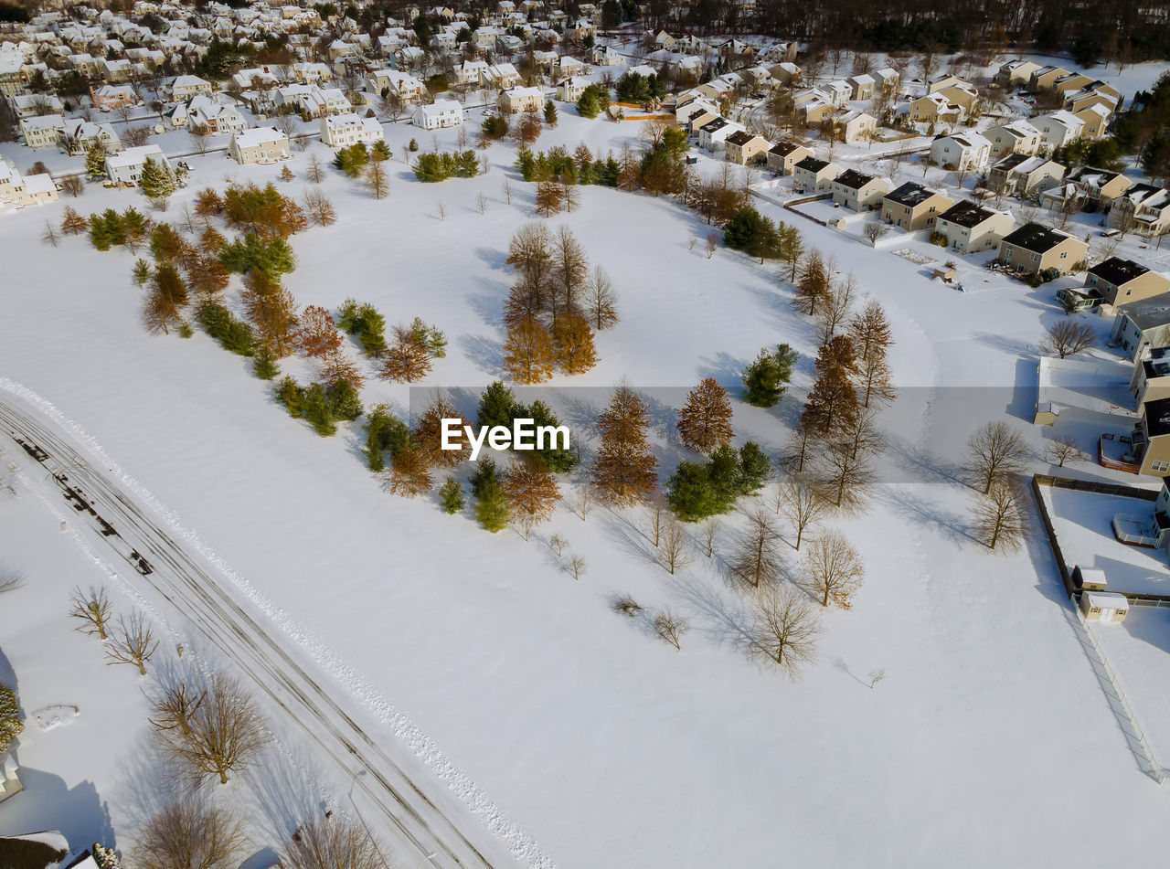 HIGH ANGLE VIEW OF SNOW COVERED LAND