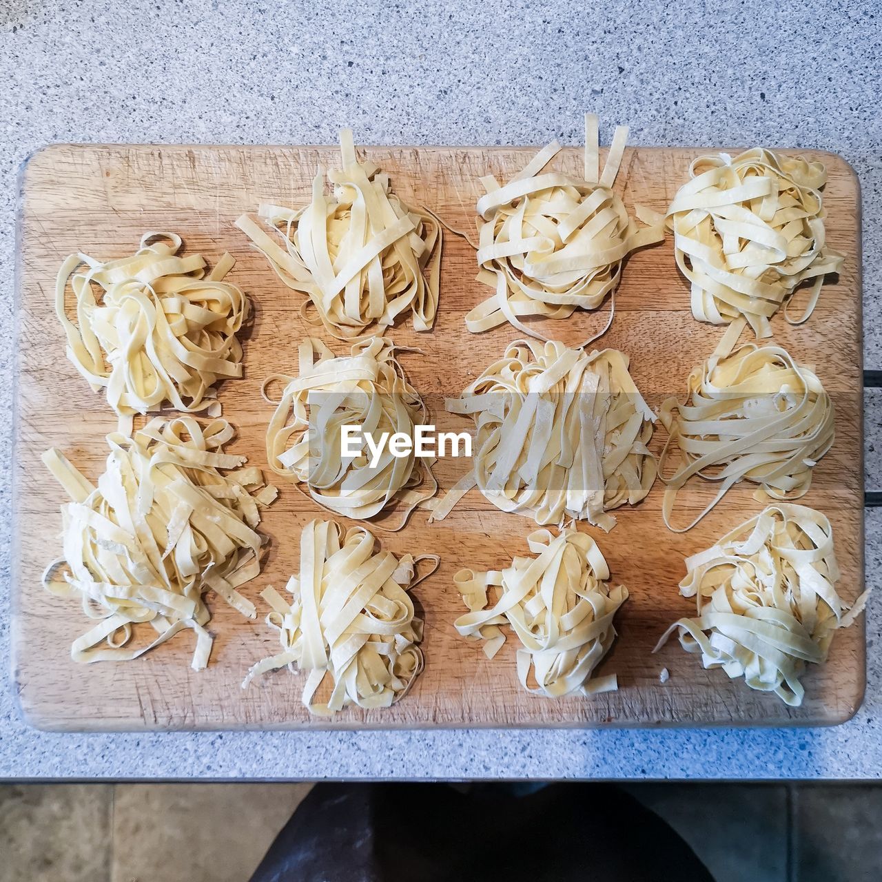 High angle view of fresh pasta on cutting board