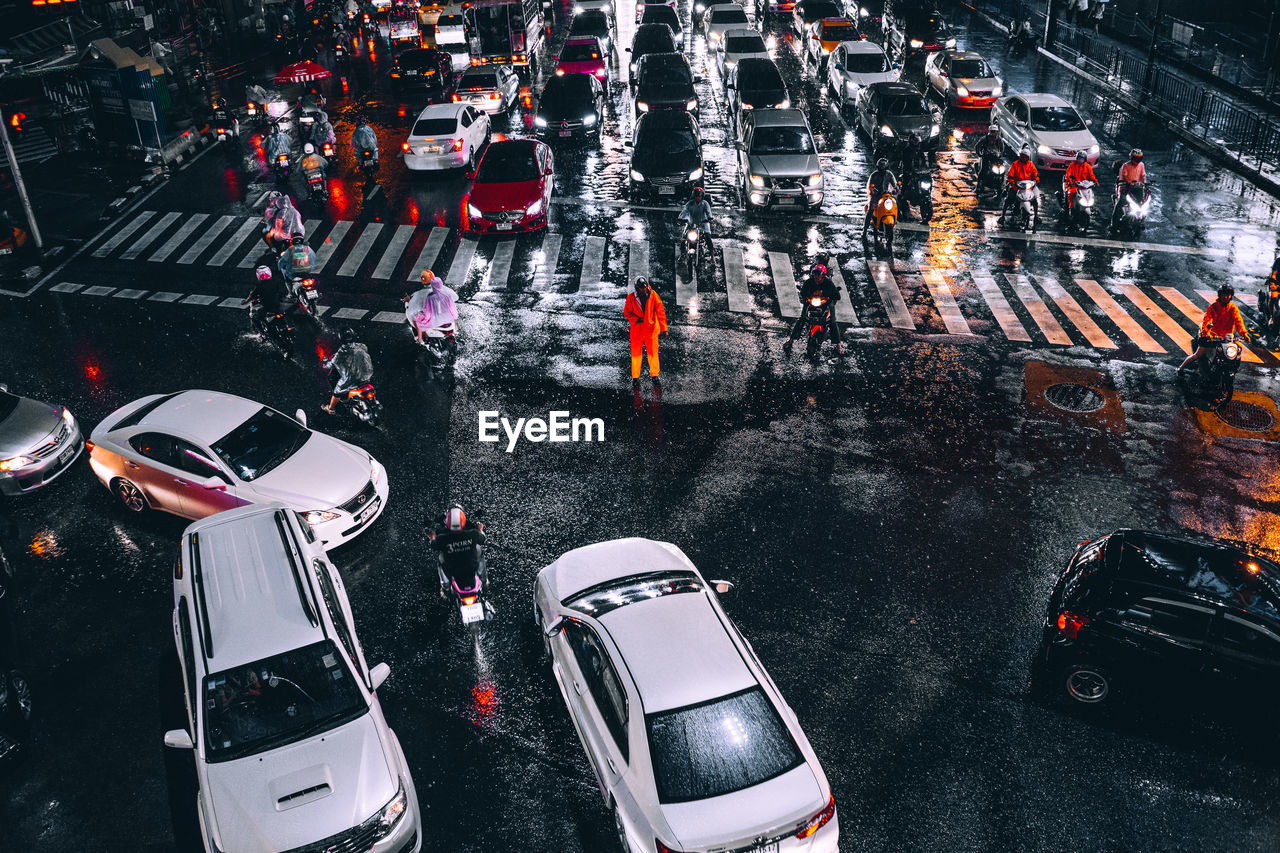 High angle view of traffic on city street during rainy season