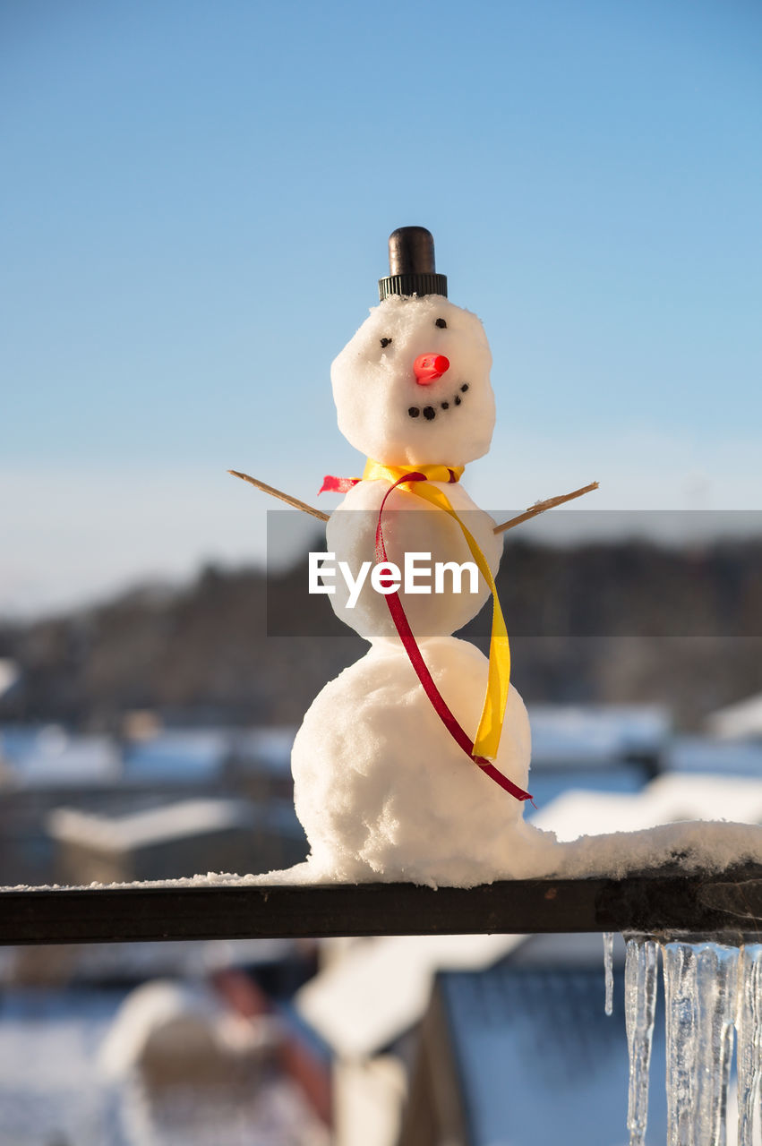 snow, snowman, winter, cold temperature, nature, day, blue, focus on foreground, sky, representation, no people, outdoors, cartoon, sunny, water, human representation, animal, craft