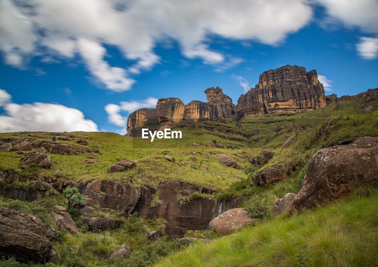 Rock formations on mountain against sky