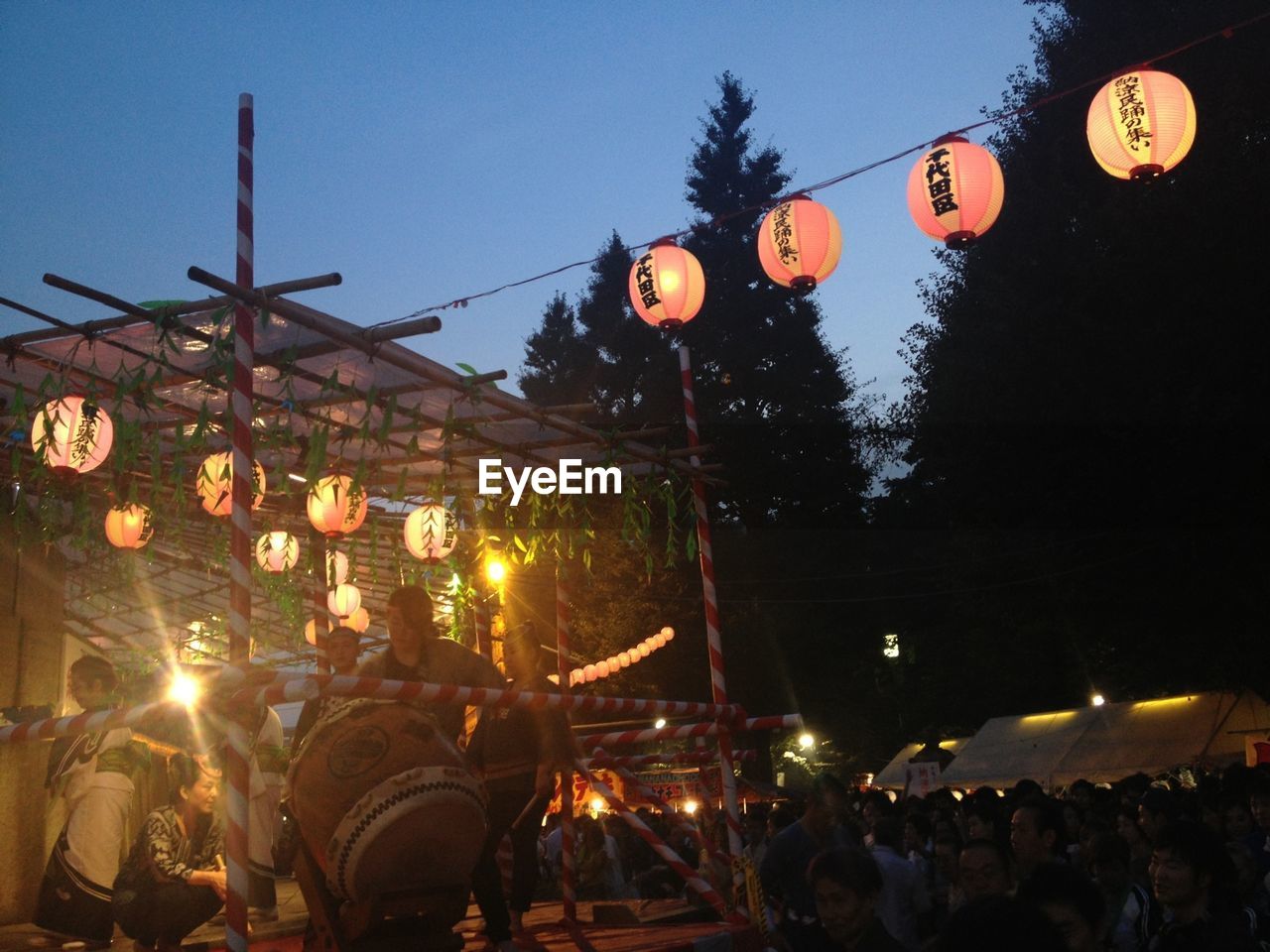 People enjoying traditional festival at night