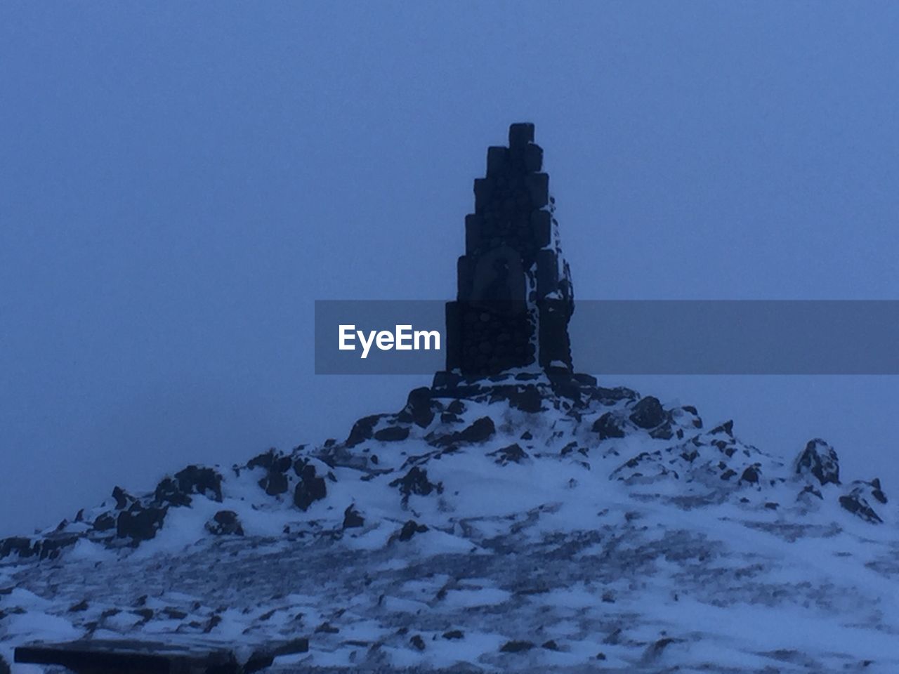 BUILT STRUCTURE IN WINTER AGAINST SKY