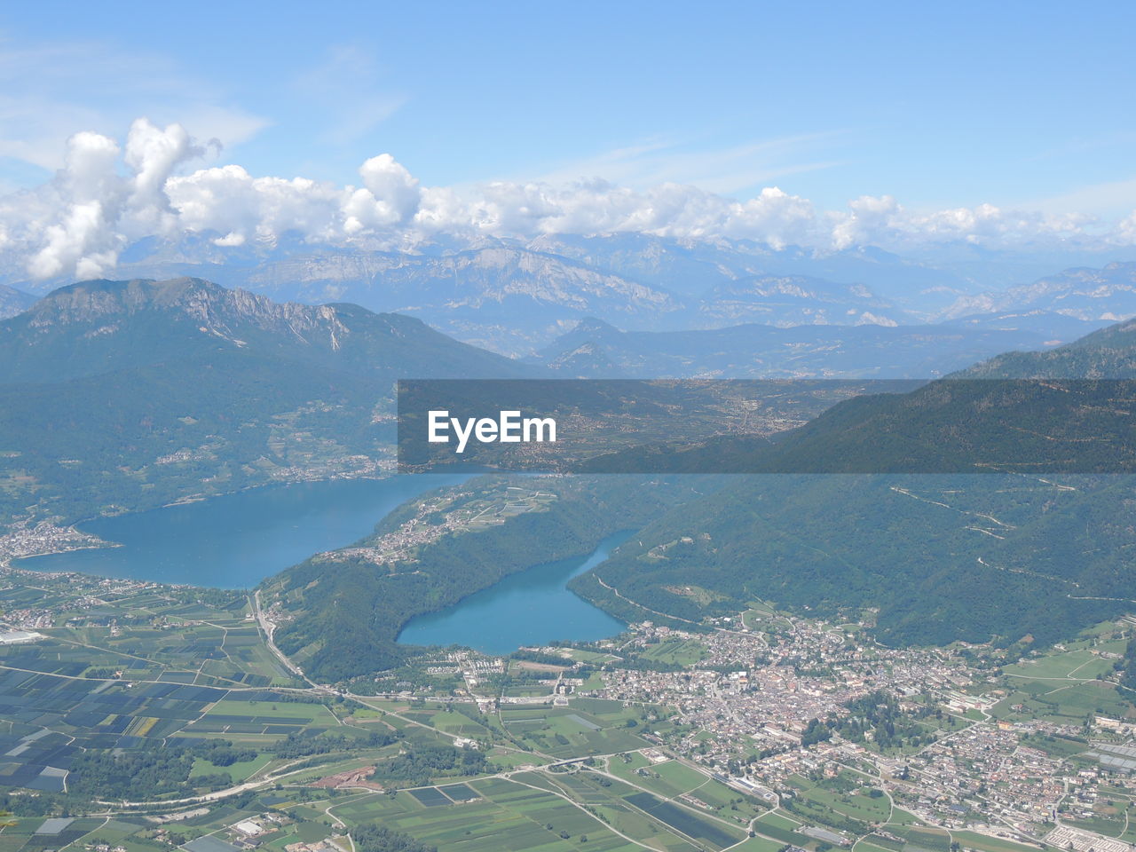 AERIAL VIEW OF LANDSCAPE AND MOUNTAINS AGAINST SKY