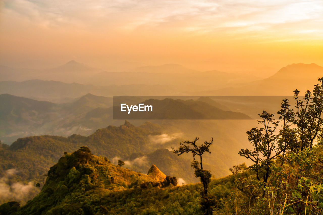 Scenic view of mountains against sky during sunset