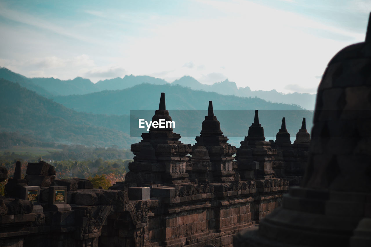 Stupas of temple against sky