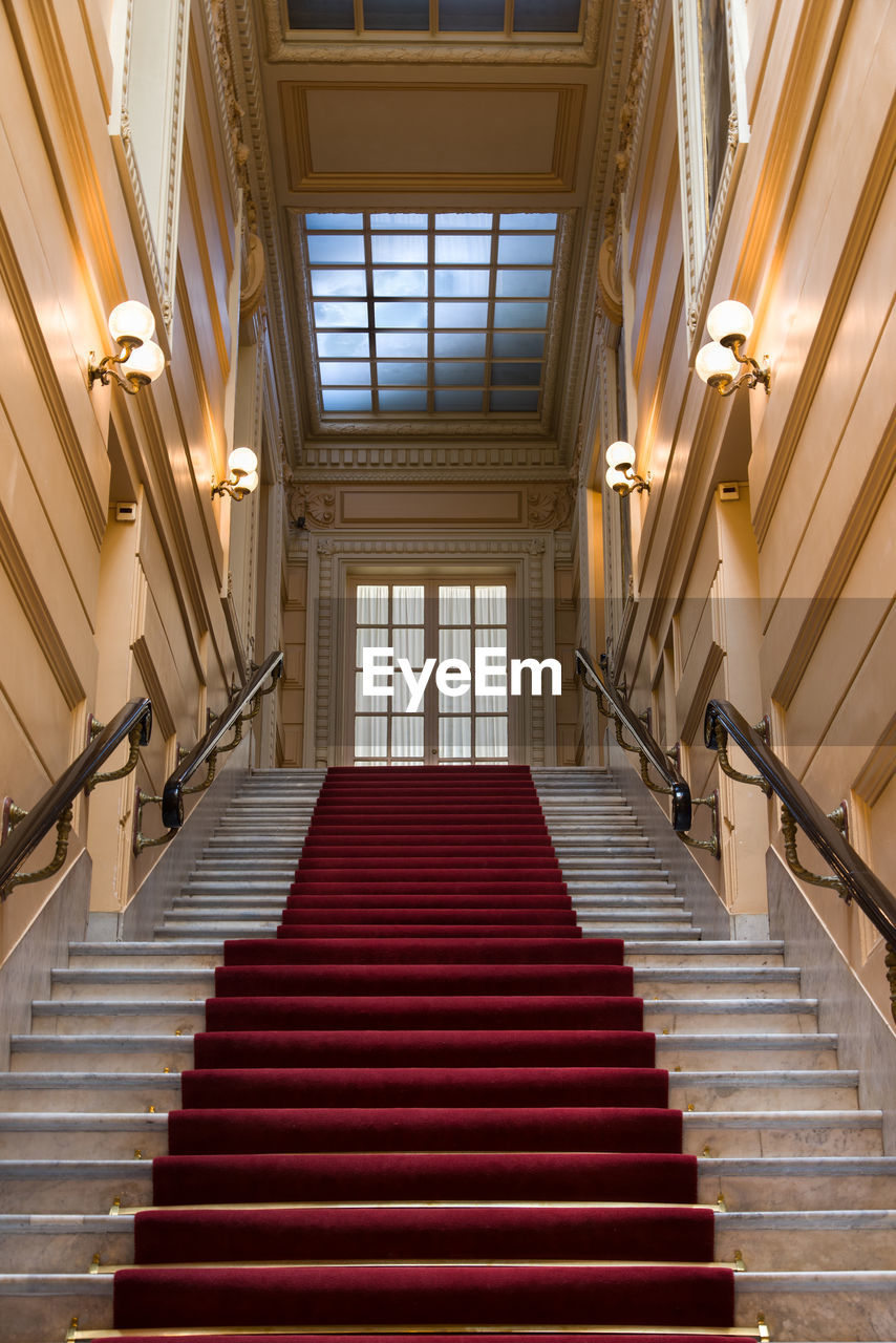 staircase, stairs, steps and staircases, architecture, railing, built structure, indoors, interior design, hall, building, no people, floor, daylighting, low angle view, wood, lighting equipment, room, the way forward, lobby, auditorium