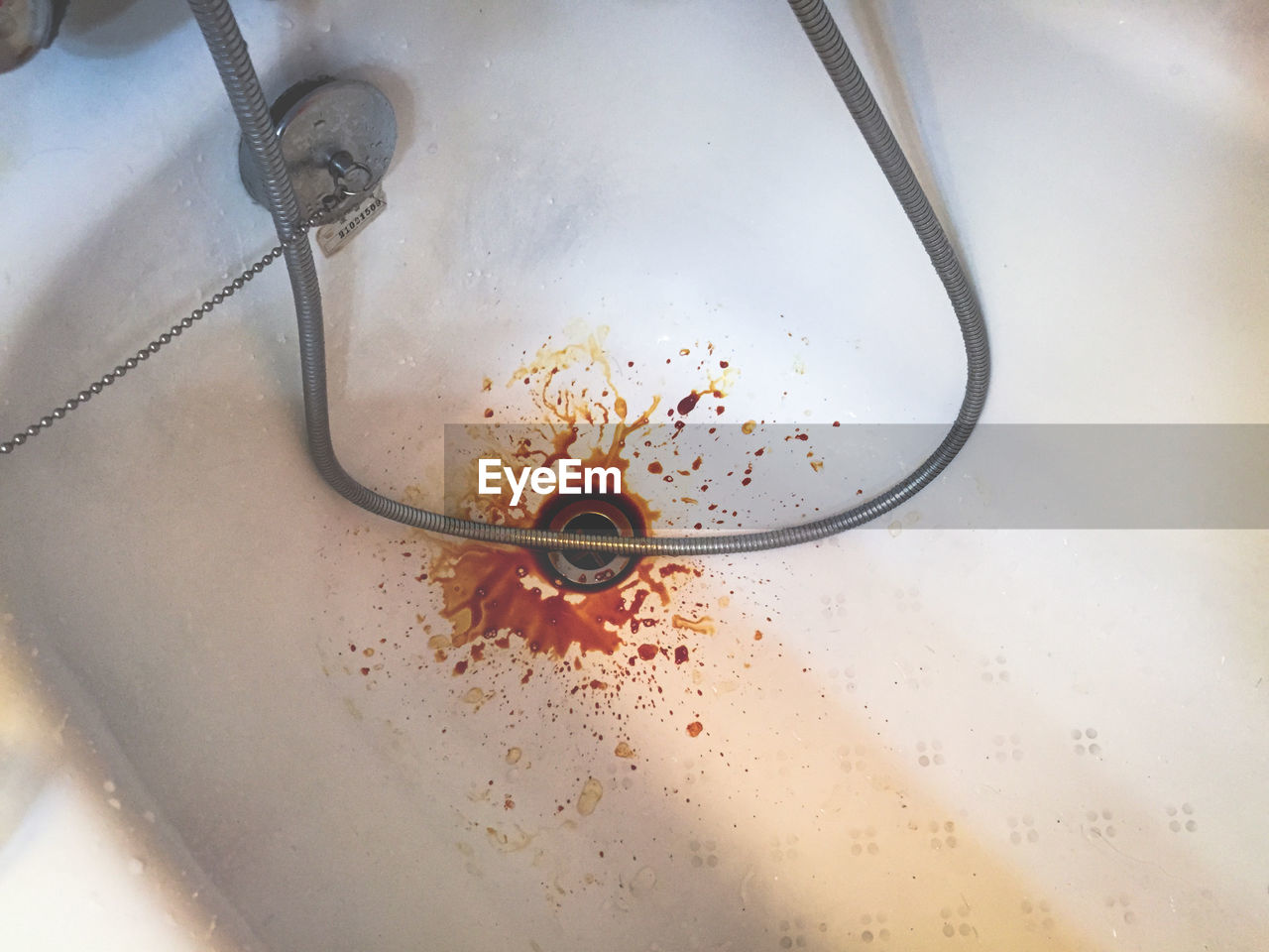 High angle view of red liquid in bathtub