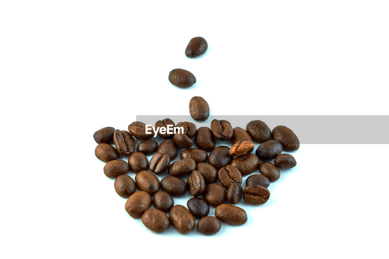 CLOSE-UP OF COFFEE BEANS IN BACKGROUND