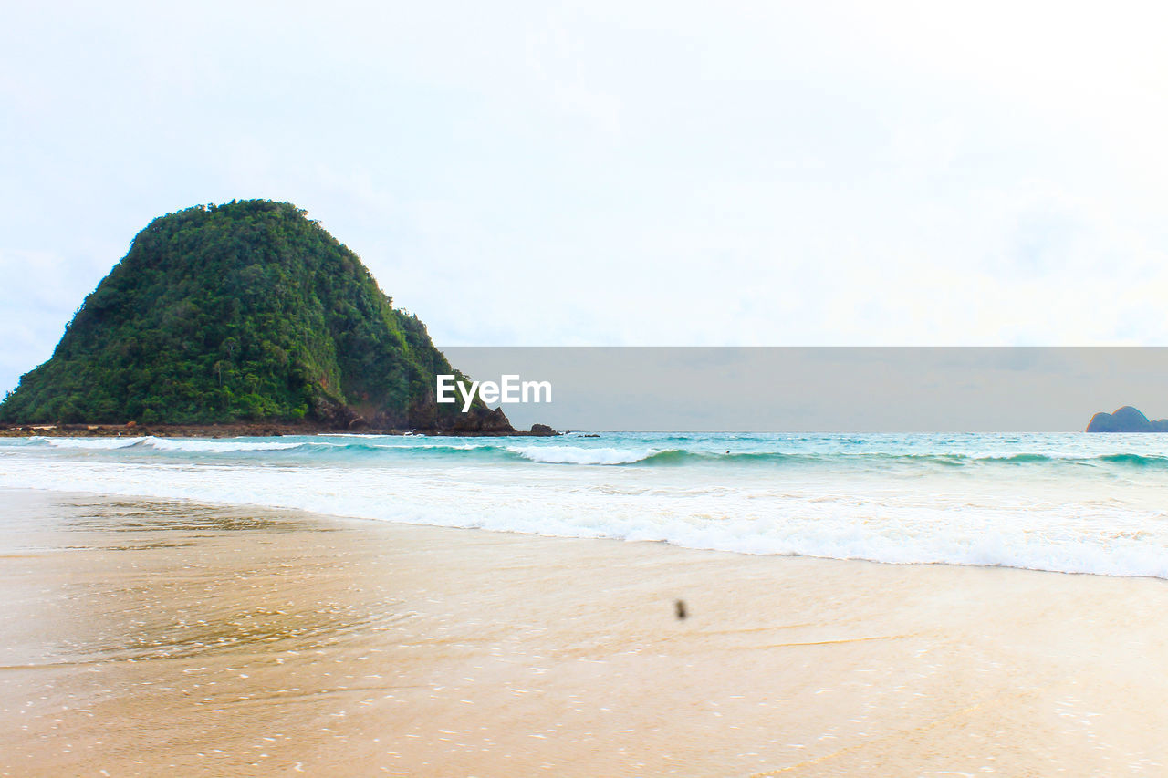 Scenic view of beach against sky