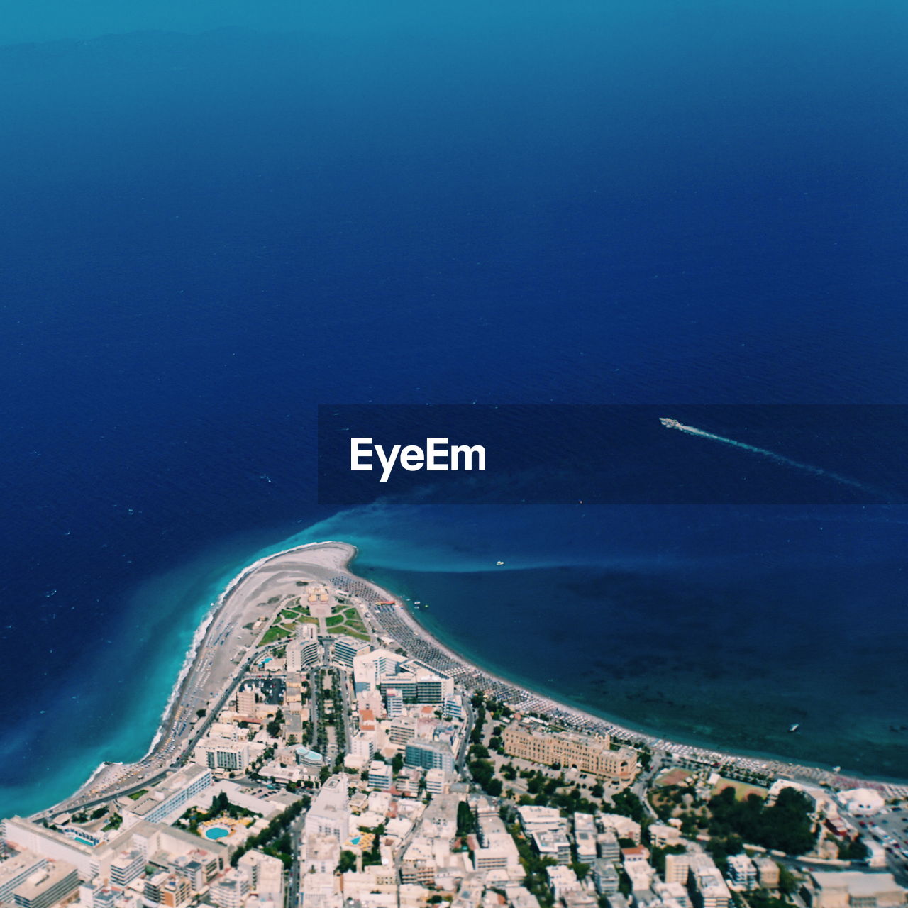 High angle view of sea and buildings in city