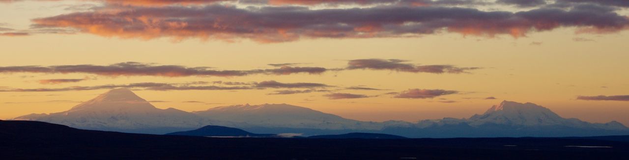 Scenic view of mountains against sky during sunset