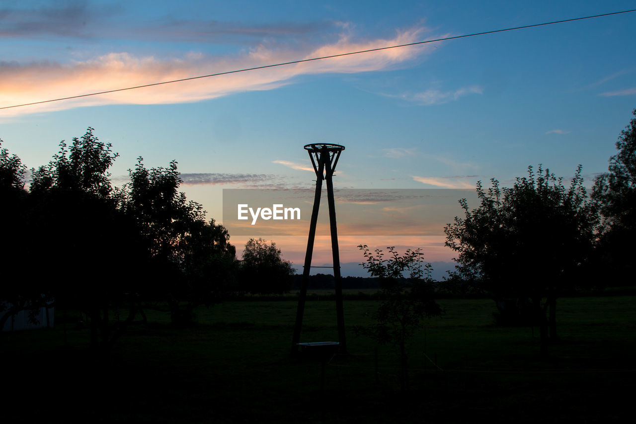 Scenic view of field against cloudy sky