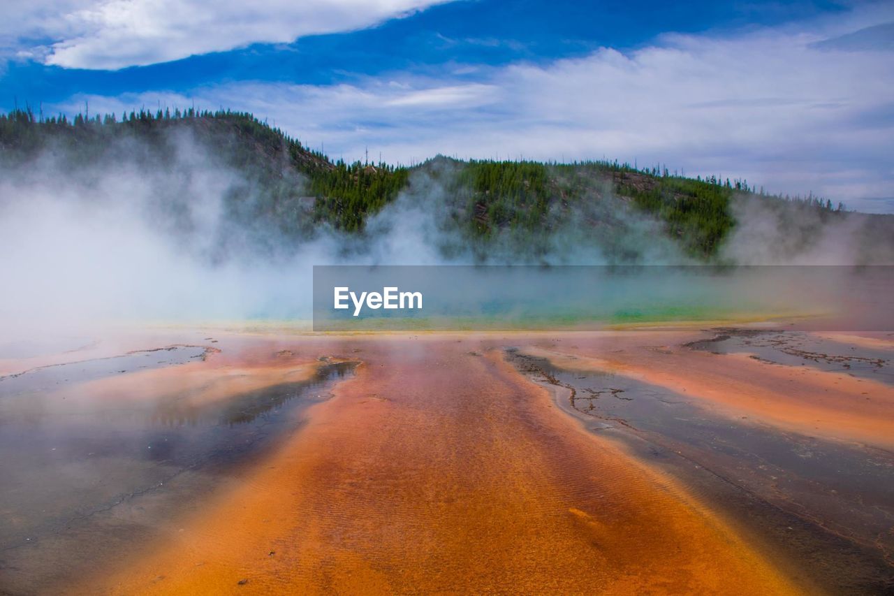 Steam on landscape against the sky