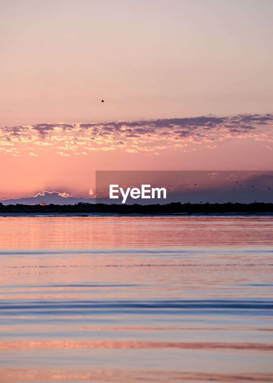 VIEW OF SEA AGAINST SKY DURING SUNSET