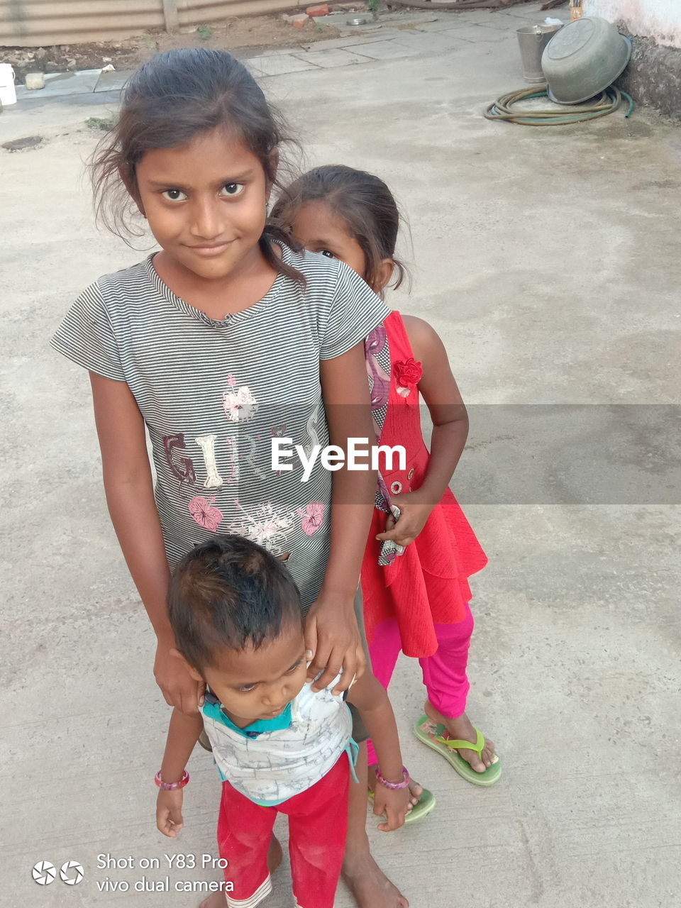 HIGH ANGLE VIEW OF MOTHER AND GIRL AND DAUGHTER ON FLOOR