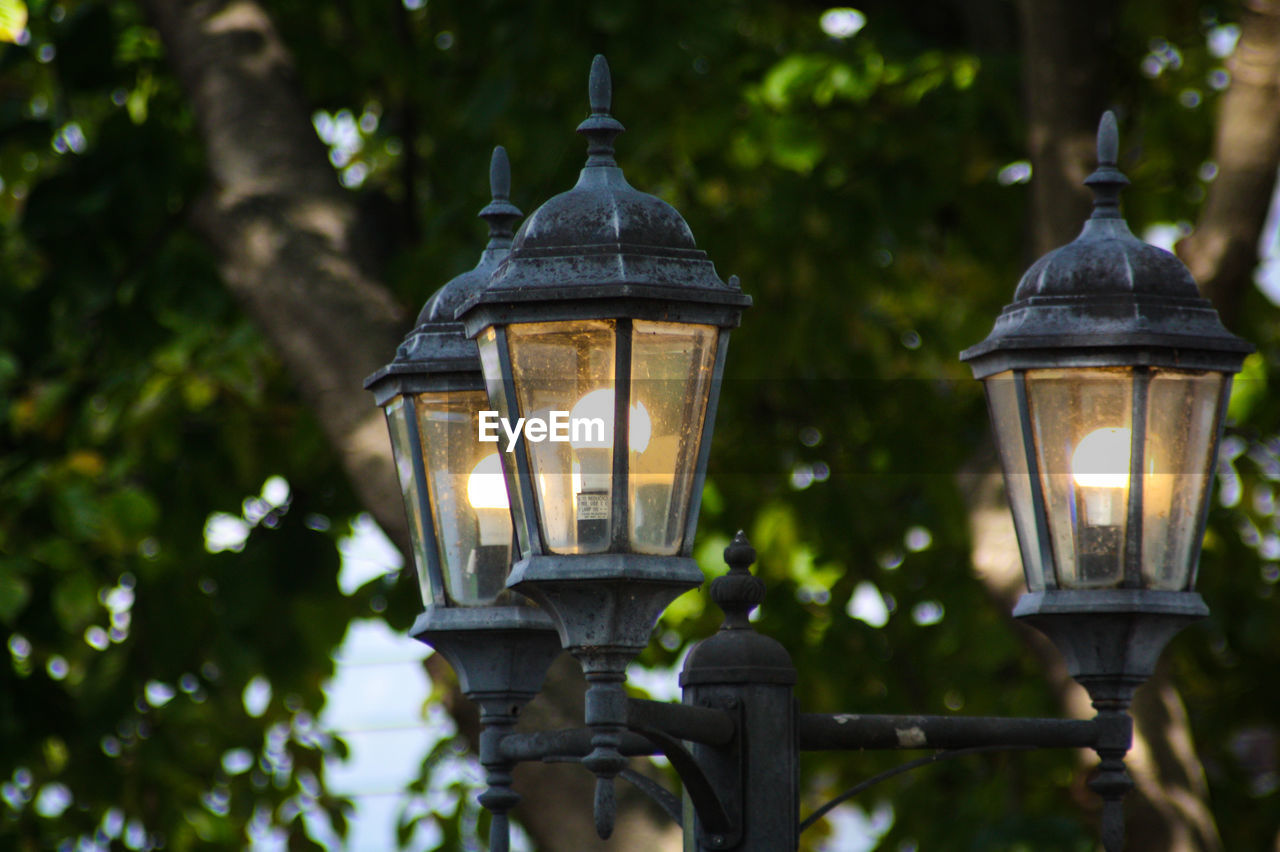 Close-up of triple light lamp post