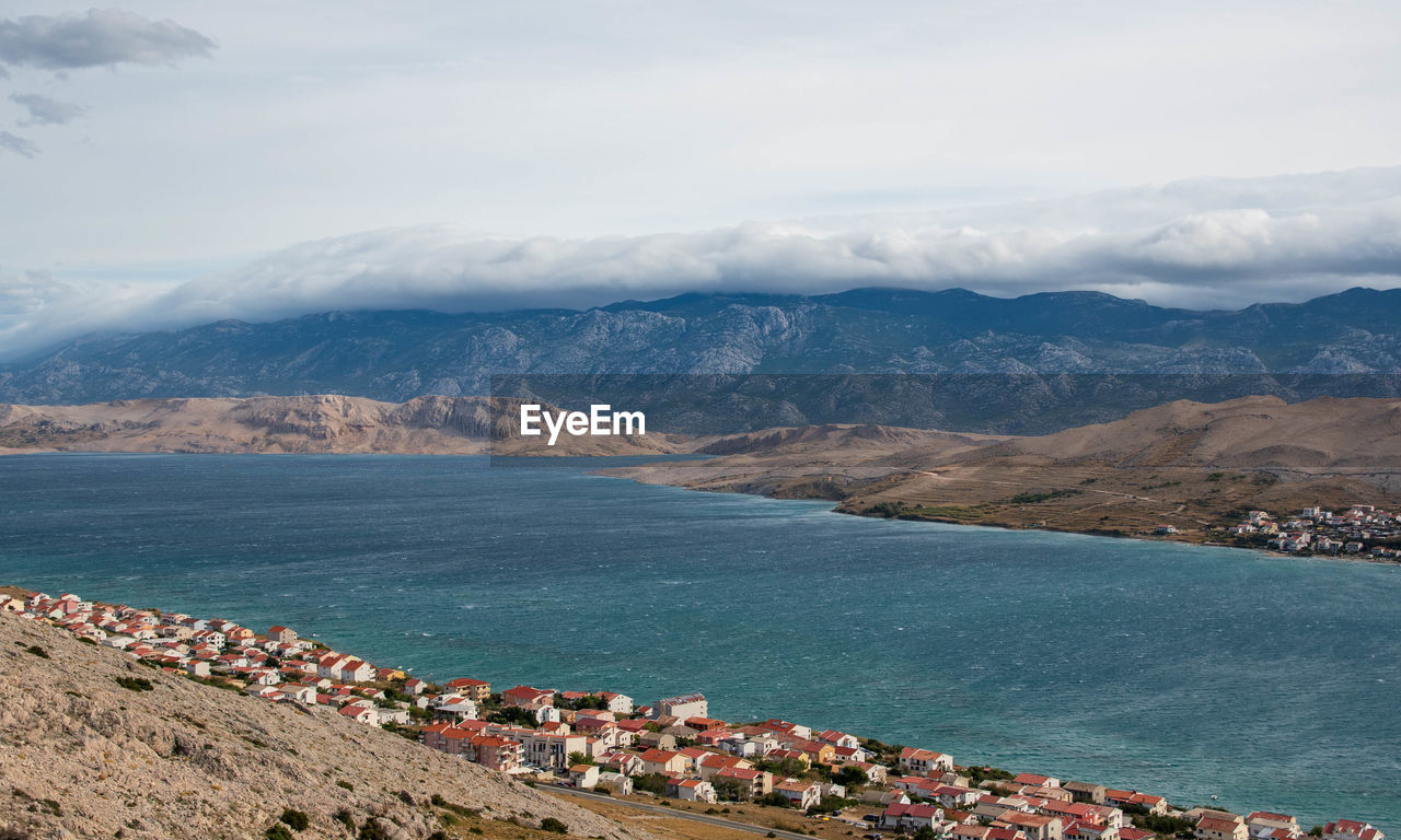 Scenic view of bay of sea, town, mountains. sky and clouds, seascape, landscape.