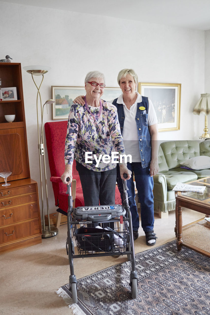Nurse in care home with senior woman
