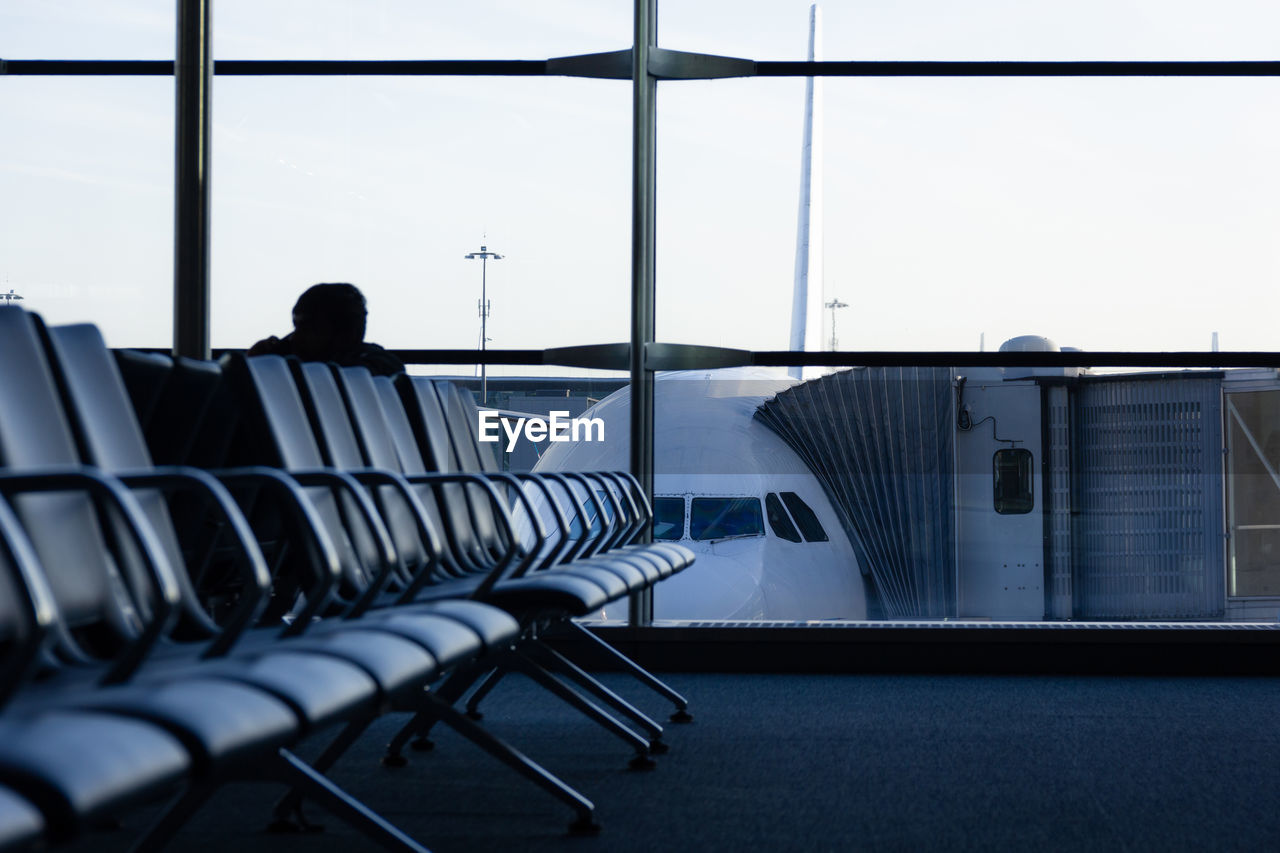 Empty chairs and tables in airport