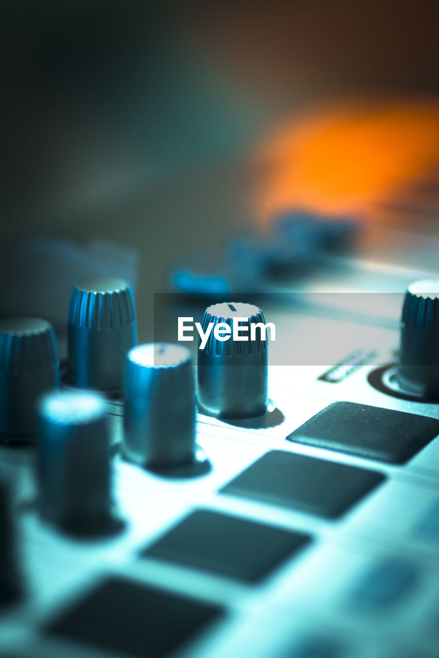 Close-up of sound mixer at studio