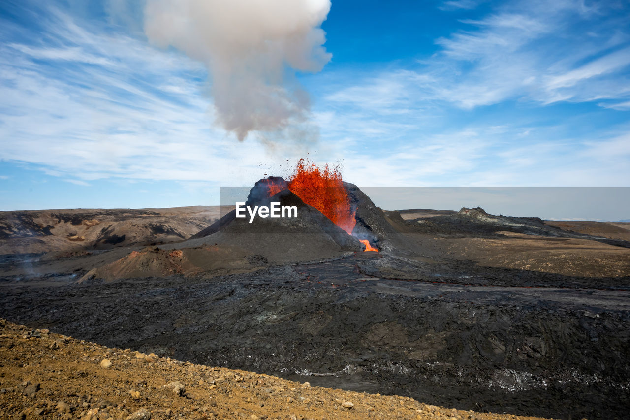 Scenic view of volcanic mountain against sky