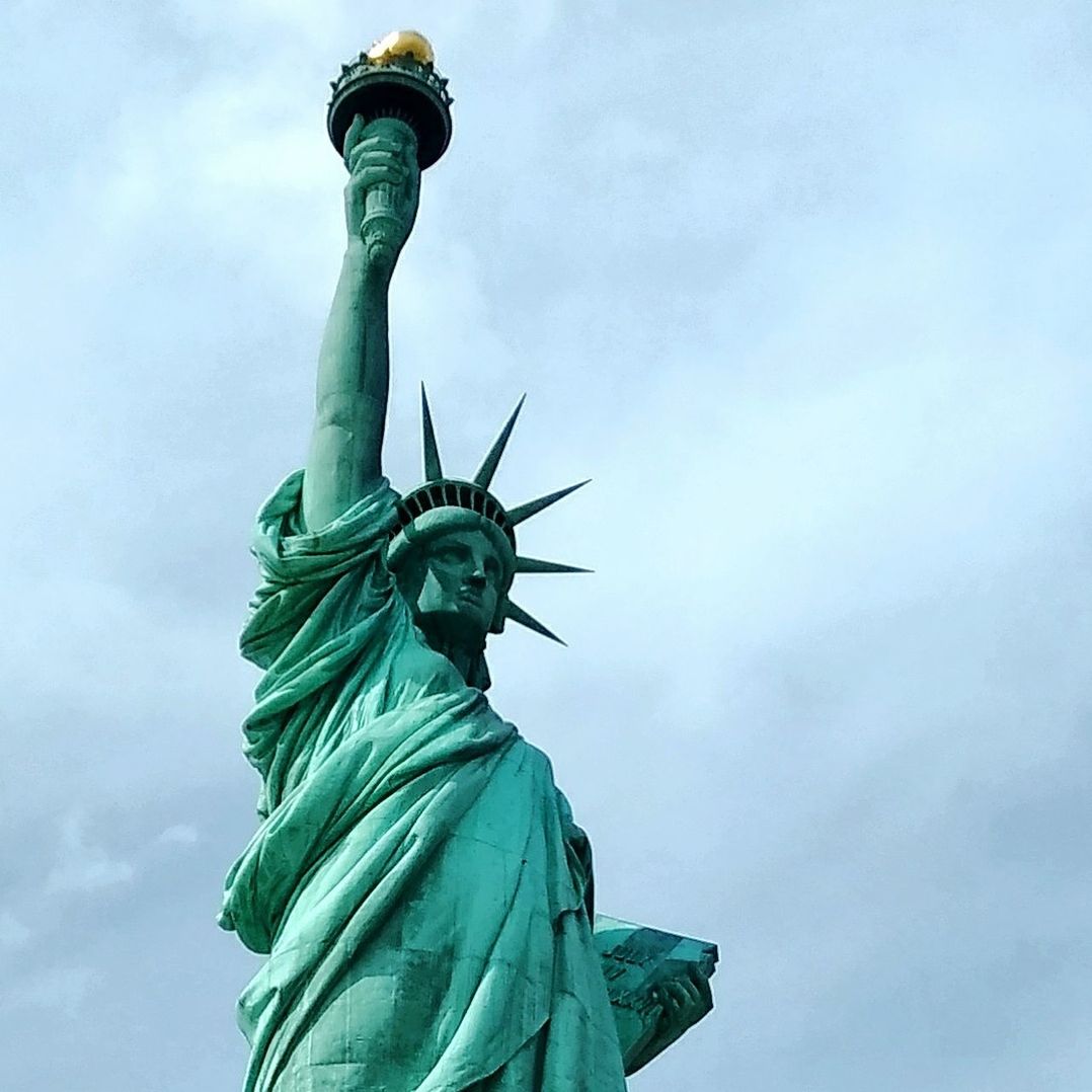 LOW ANGLE VIEW OF STATUE OF LIBERTY AGAINST SKY