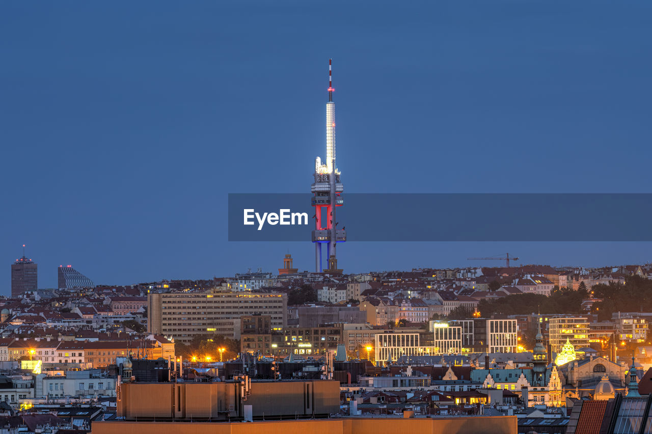 The zizkov tv tower and the city of prague, czech republic, at dusk