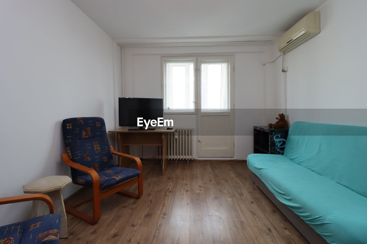 VIEW OF EMPTY CHAIRS IN ROOM