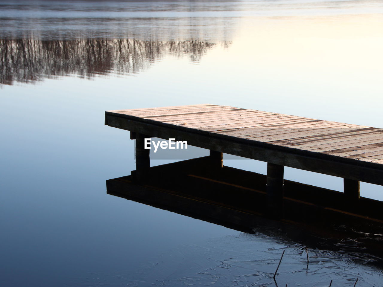 PIER ON LAKE AGAINST SKY