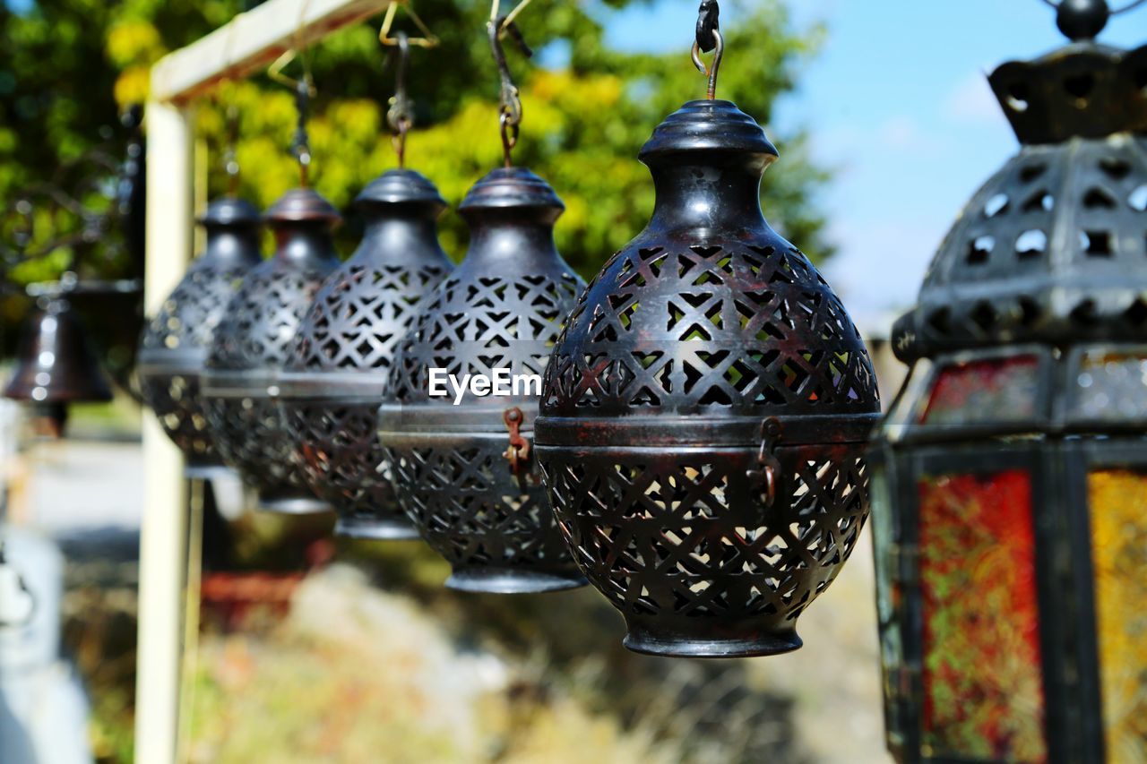 Close-up of hanging lamps against blurred background