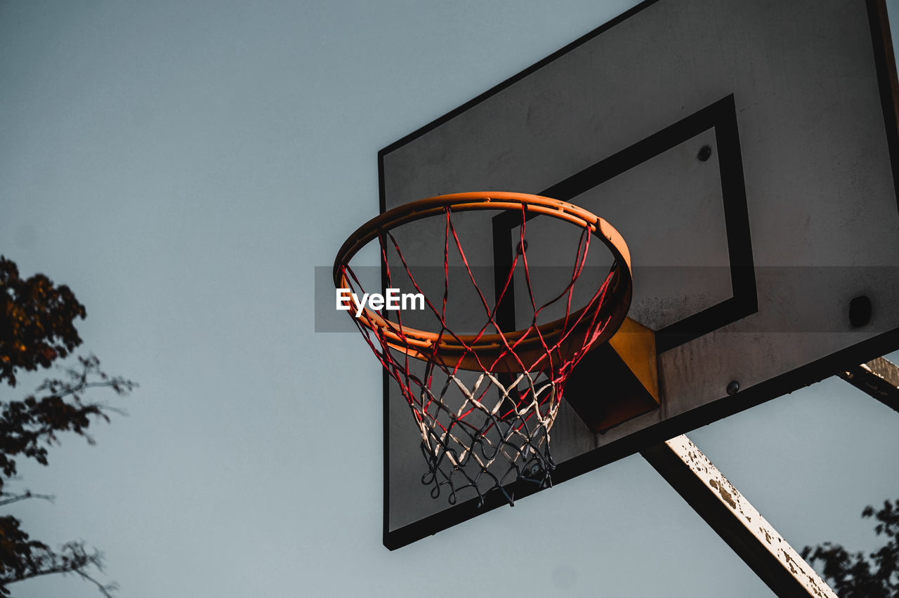 LOW ANGLE VIEW OF BASKETBALL HOOP