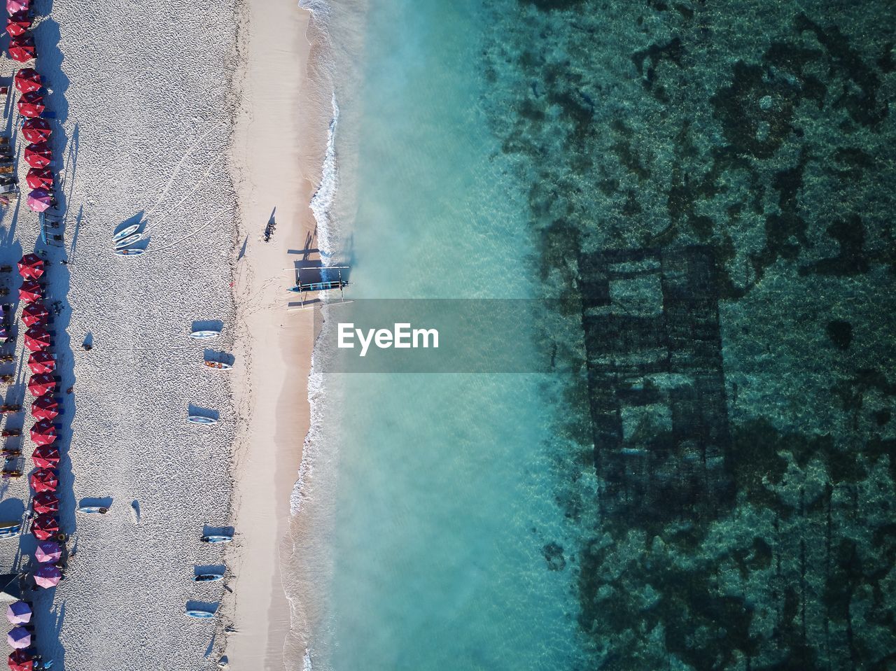 HIGH ANGLE VIEW OF SWIMMING POOL IN SEA