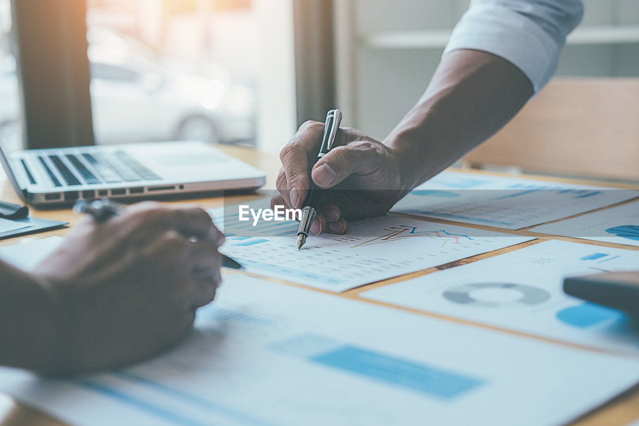 Business colleagues working at desk in office