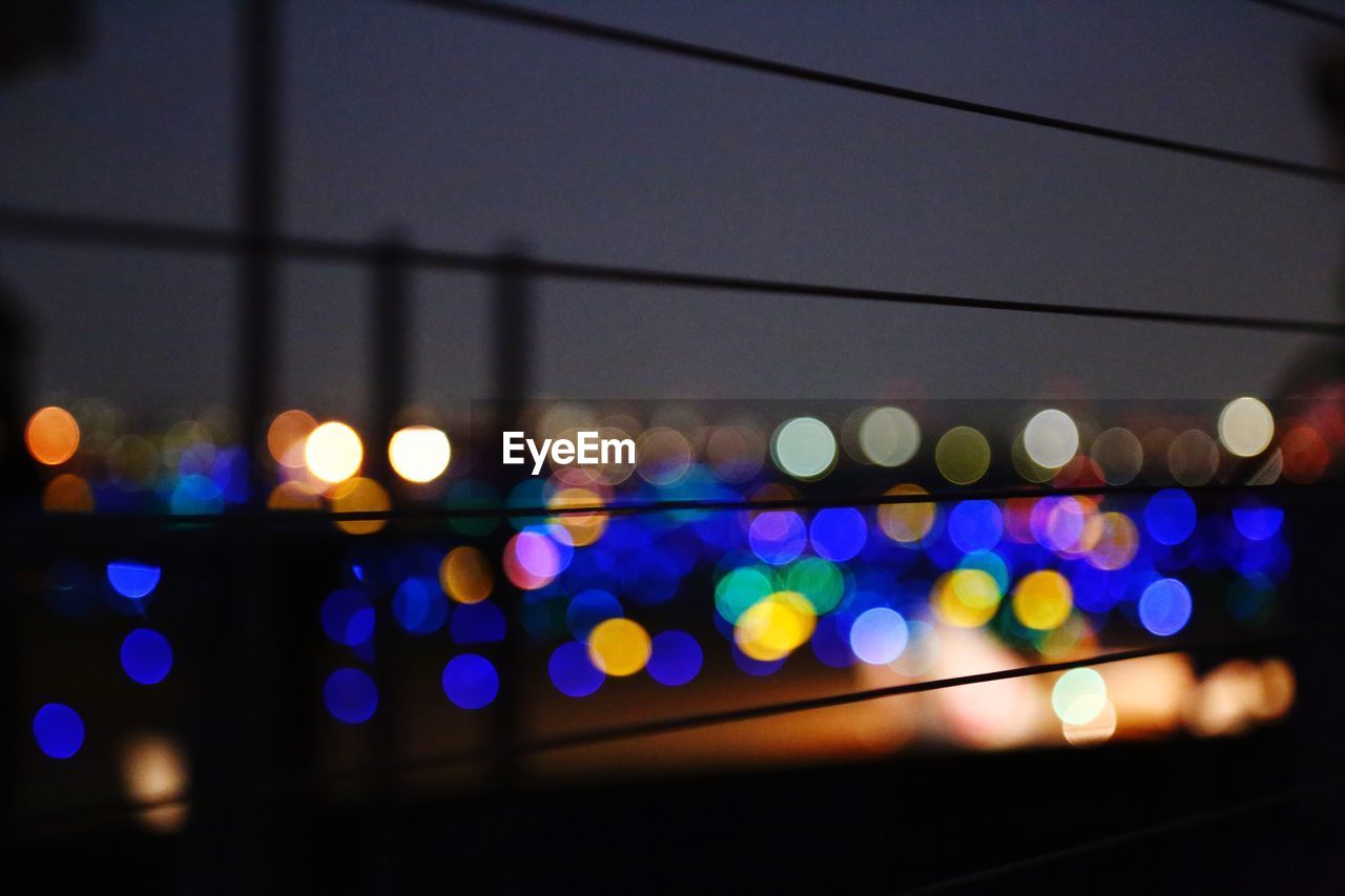 DEFOCUSED IMAGE OF ILLUMINATED LIGHTS