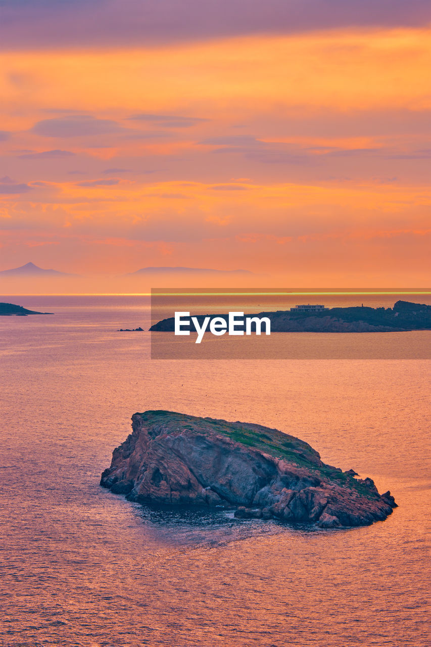 Aegean sea with islands view on sunset