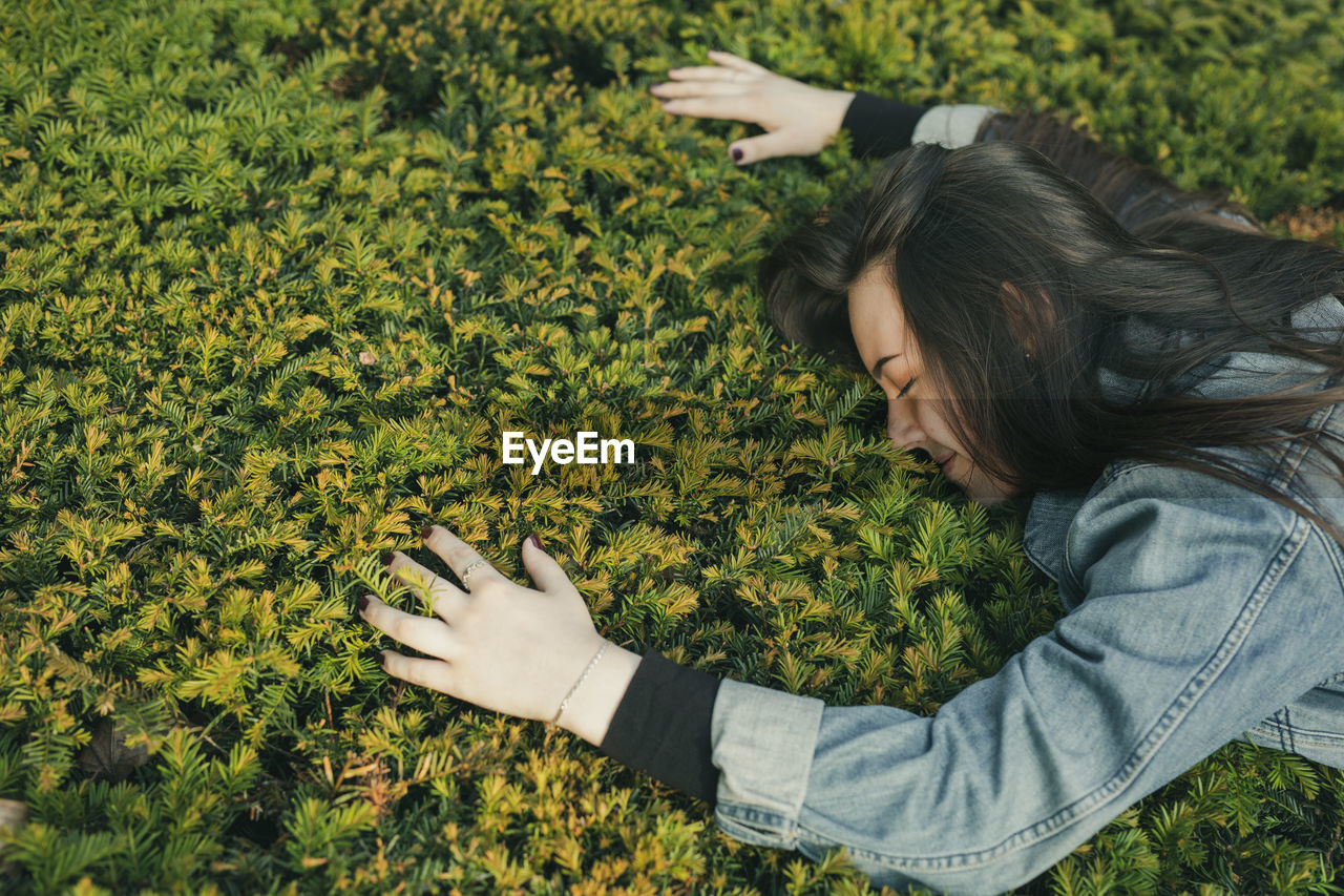 Young woman on plants