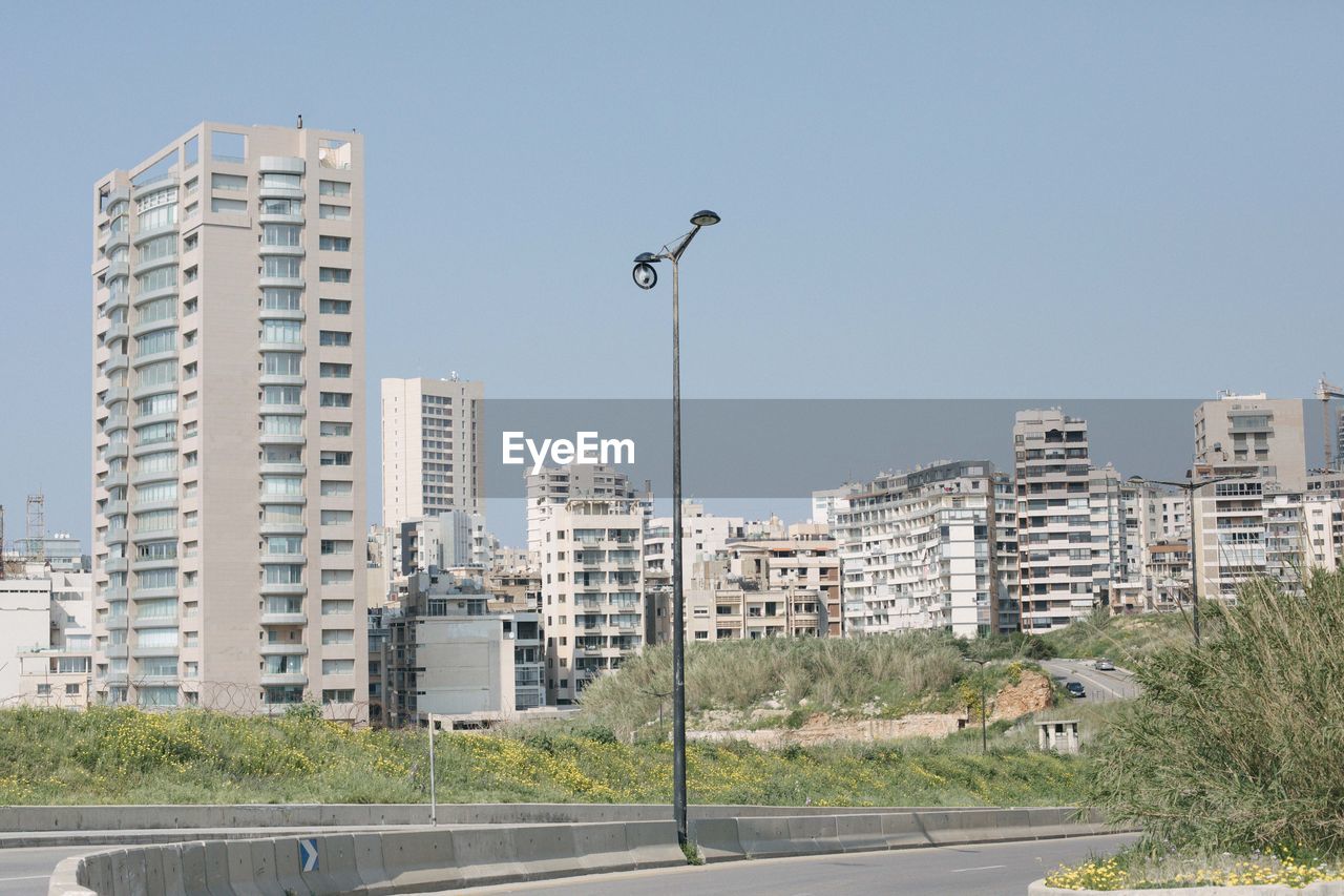 LOW ANGLE VIEW OF STREET AGAINST BUILDINGS