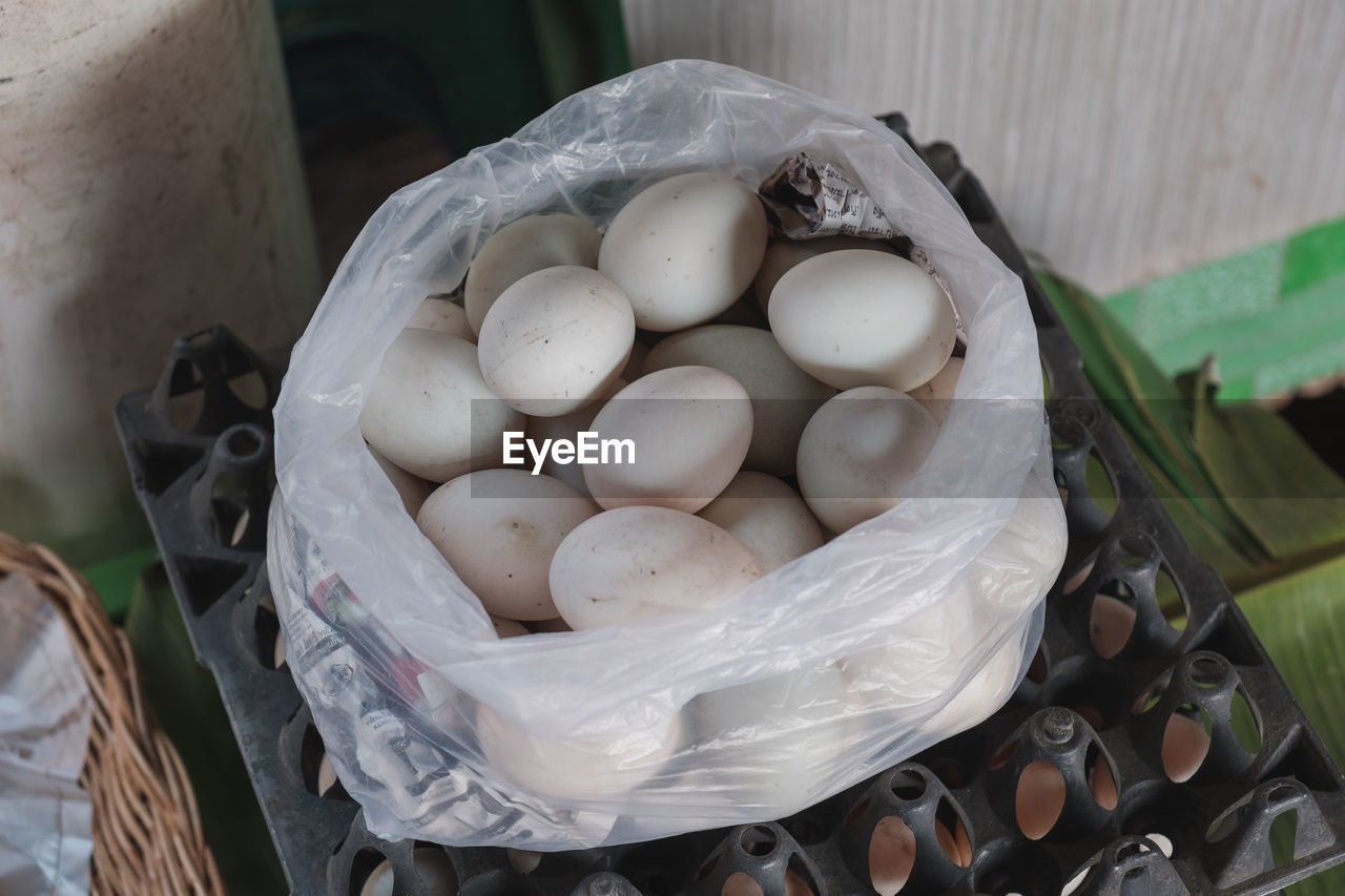 High angle view of eggs in basket at market