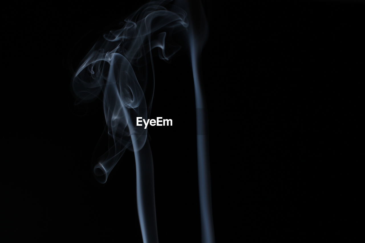 Close-up of smoke against black background