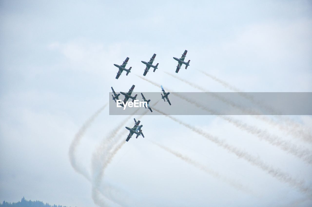 LOW ANGLE VIEW OF AIRPLANE IN FLIGHT