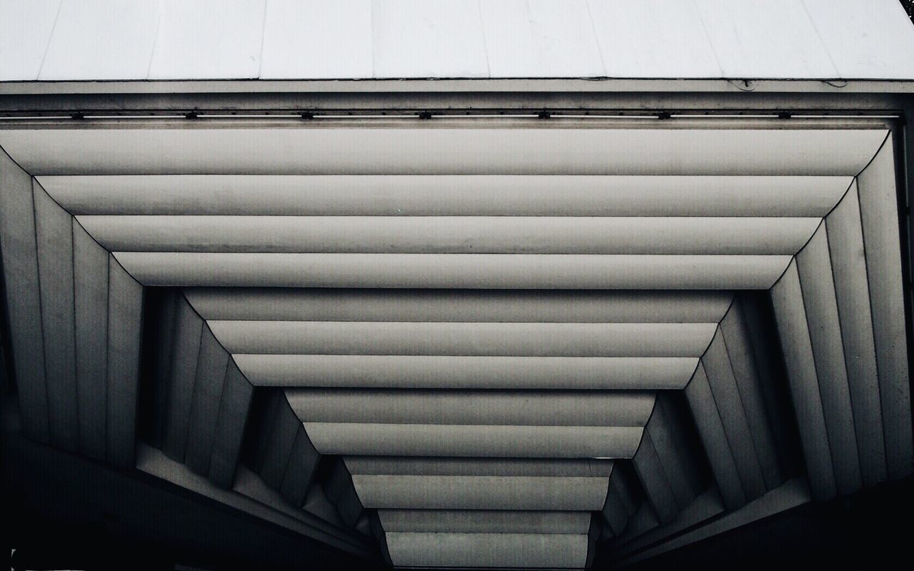 LOW ANGLE VIEW OF ESCALATORS