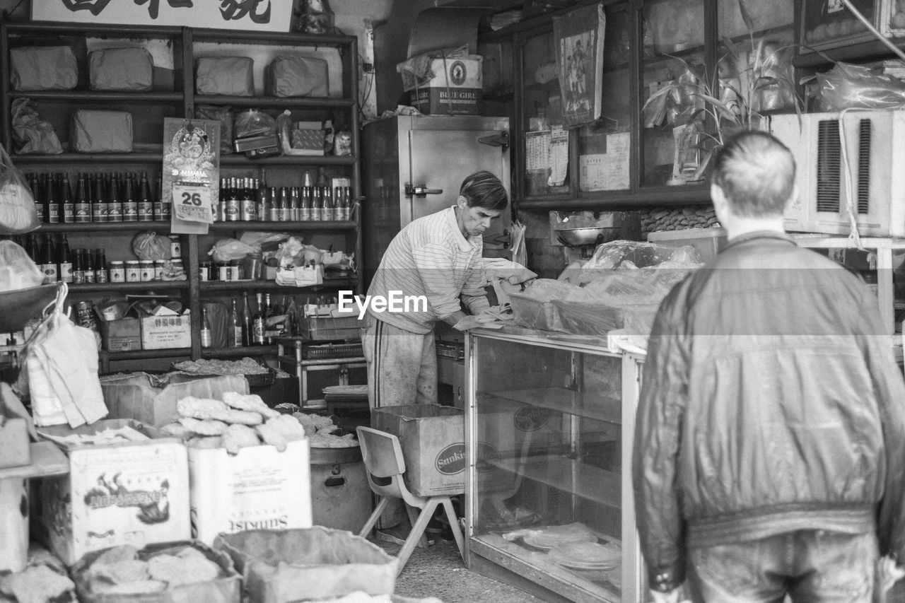 MEN AT MARKET