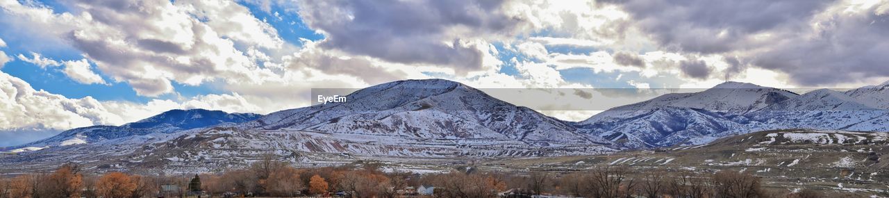 Oquirrh mountain range snow capped, bingham canyon mine kennecott copper mine salt lake utah. usa.