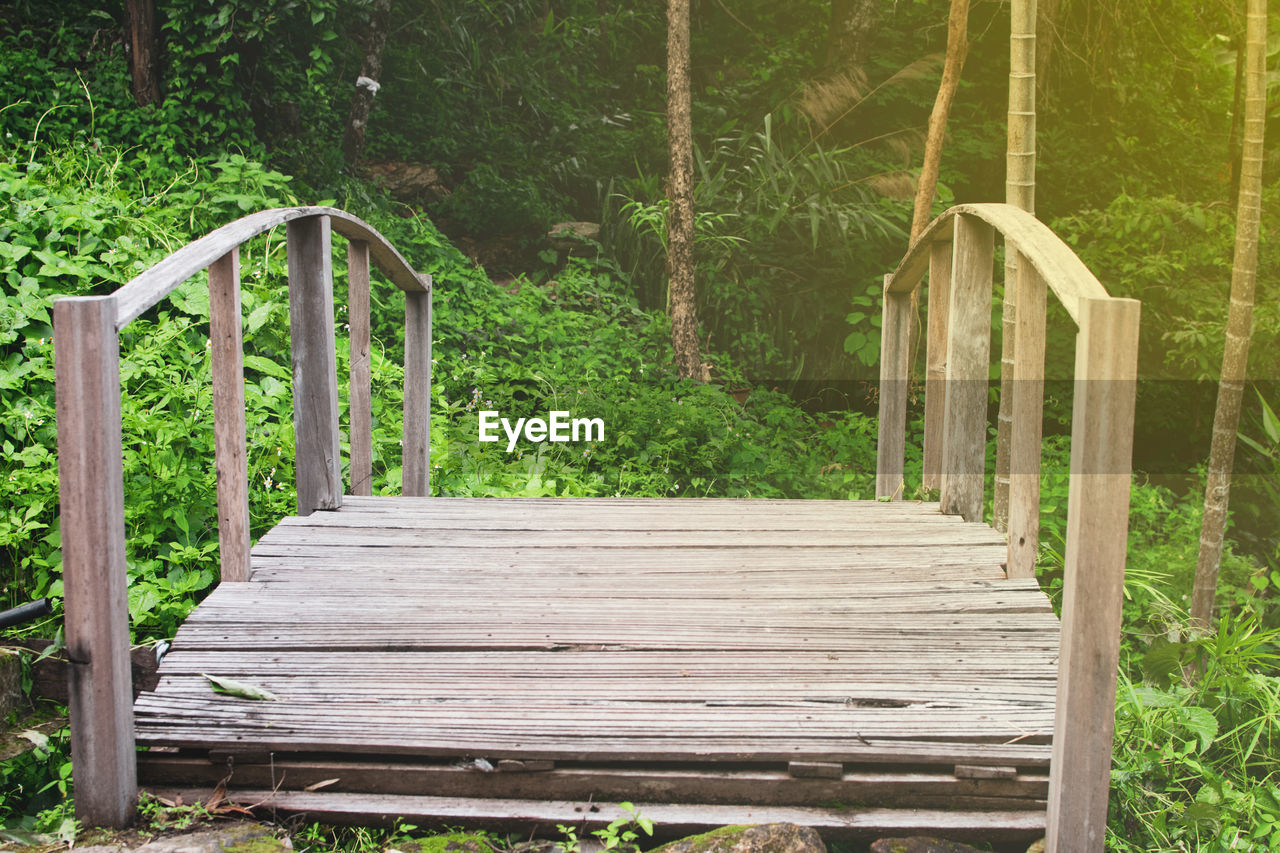 high angle view of wooden bench in park