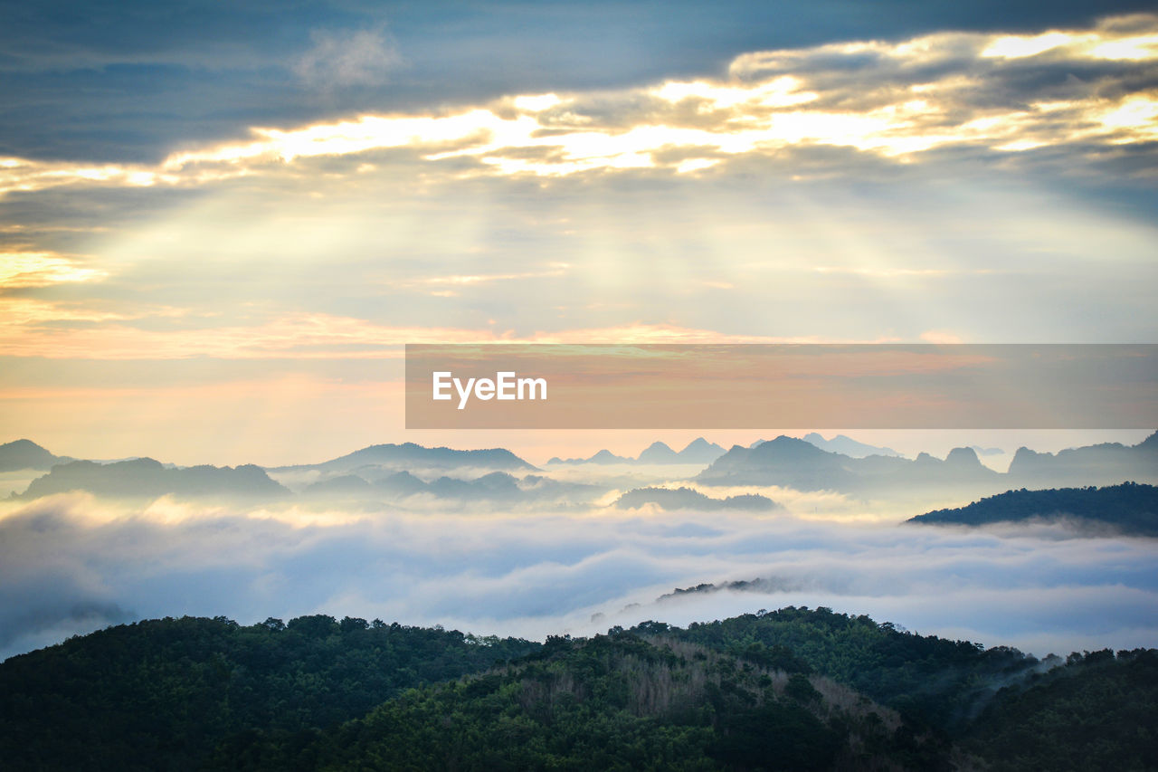 Scenic view of mountains against sky during sunset