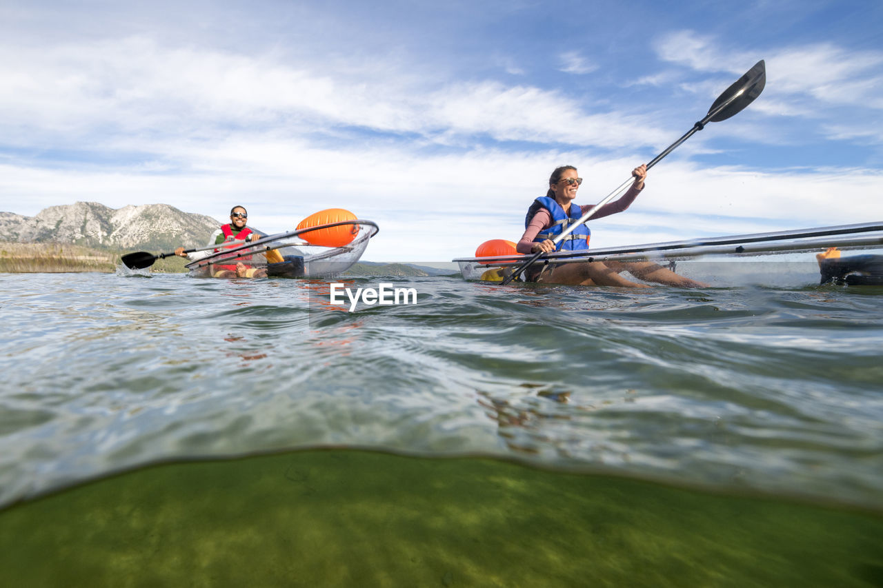 Kayakers enjoying a summer morning paddling on lake tahoe, ca