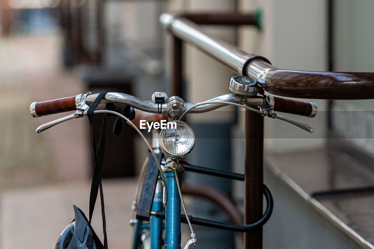 CLOSE-UP OF BICYCLE ON METAL